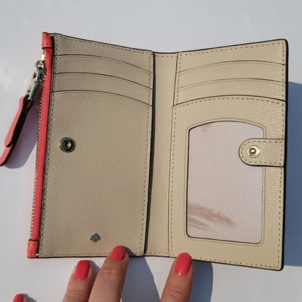 Kate Spade Leather Roulette Small Slim Bifold Wallet. Color: Peachmelba.